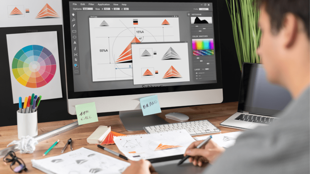 Brand development and logo variations on screen demonstrating why graphic design matters for consistent branding by Deacon Solutions