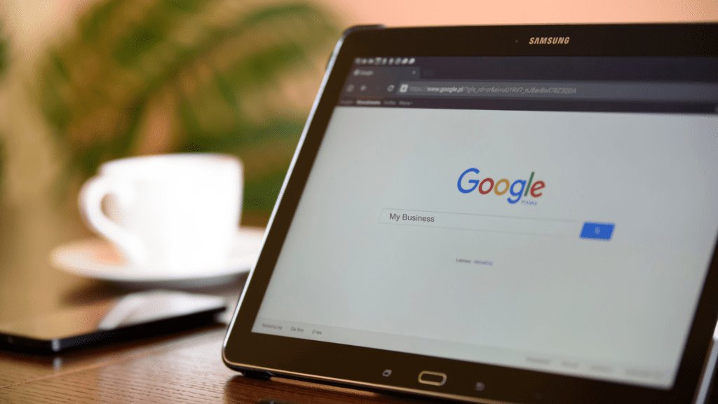 Deacon Solutions Google Business Profile Optimization Guide showing a business searching Google My Business on a tablet