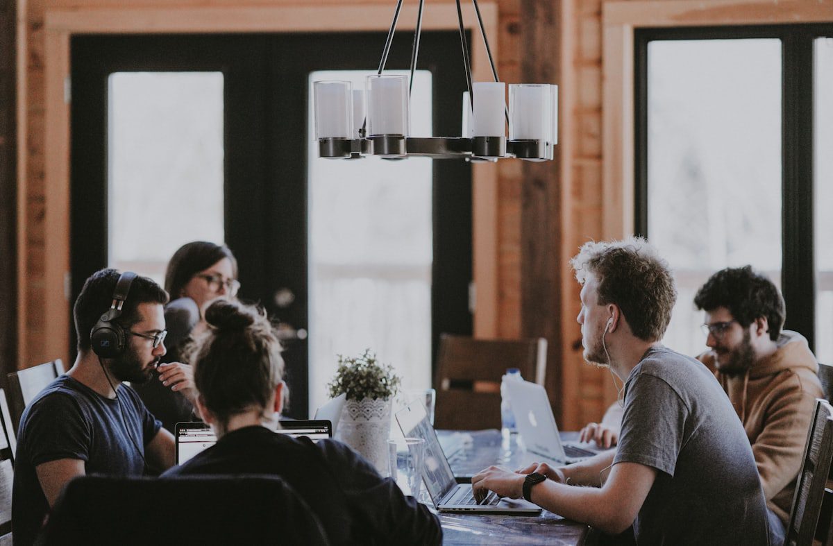 A small team discussing digital marketing services and communication priorities