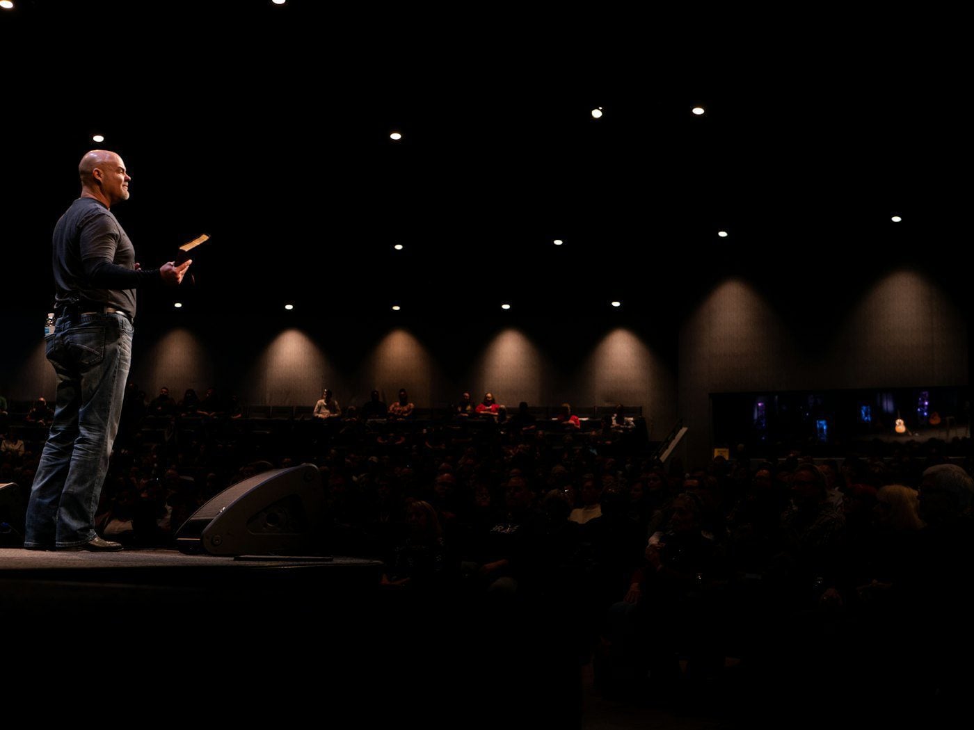 A pastor preaching to a congregation during a Sunday service for church digital marketing support